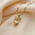 Bow Heart Pendant Necklace - Gold plated chain